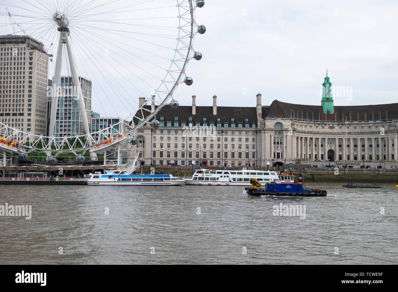 M.P.V. Shake Dog Barge passes by the london eye on the river thames, london, uk Stock Photo