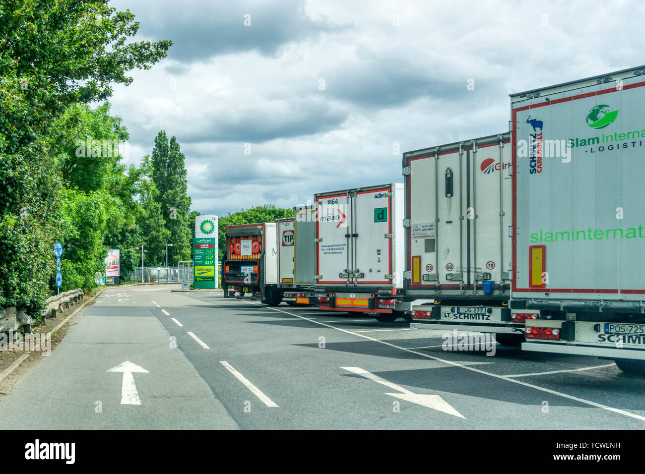 The backs of mainly continental European lorries parked at Medway Services on the M2. Stock Photo