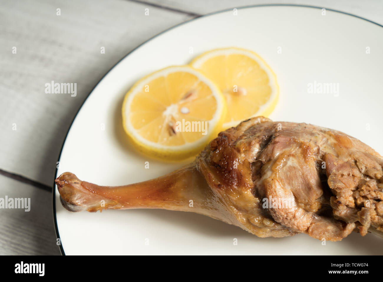 Roast duck leg with light color background Stock Photo - Alamy