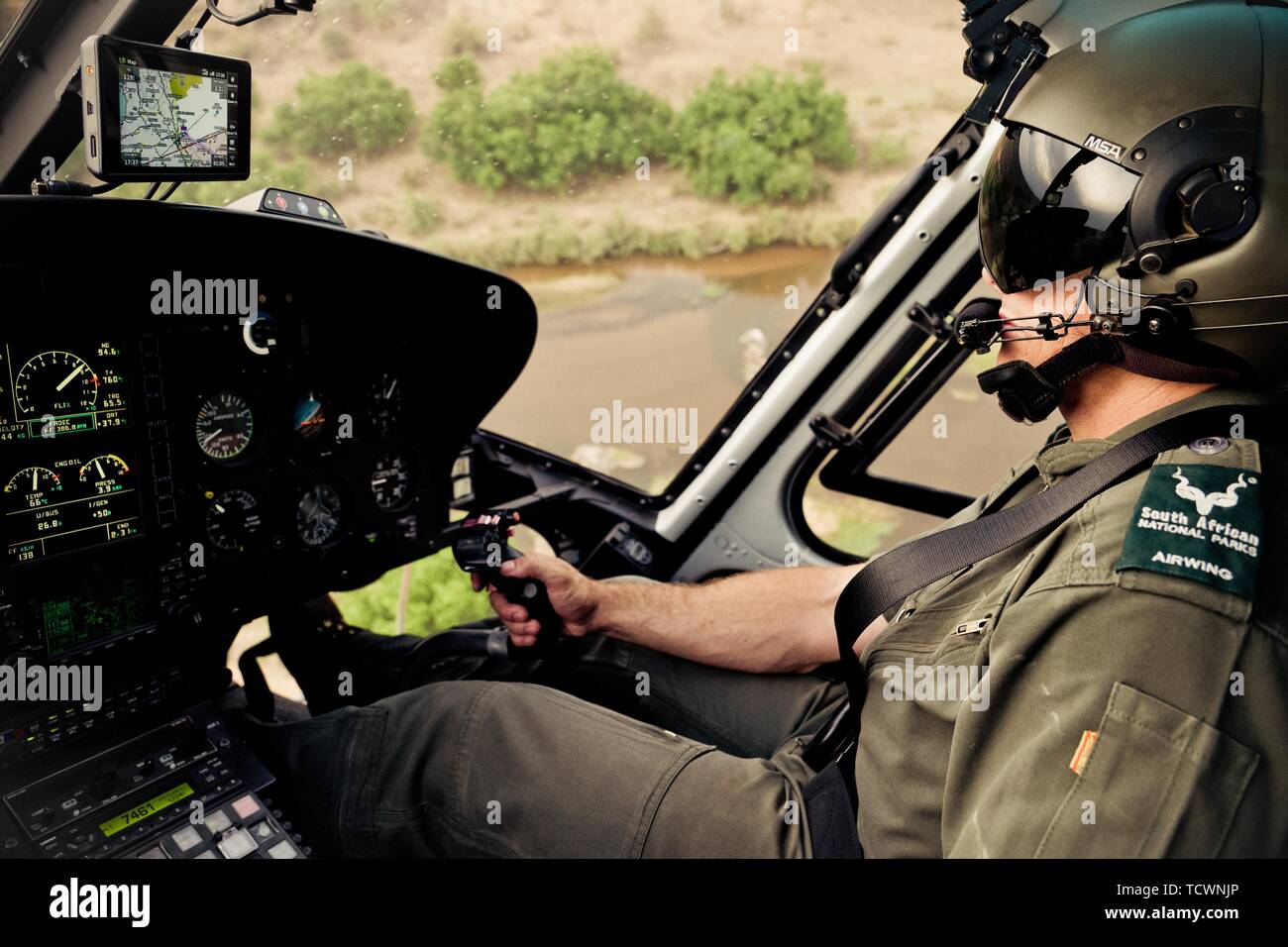 Helicopter pilot monitors poaching, Kruger National Park, South Africa Stock Photo