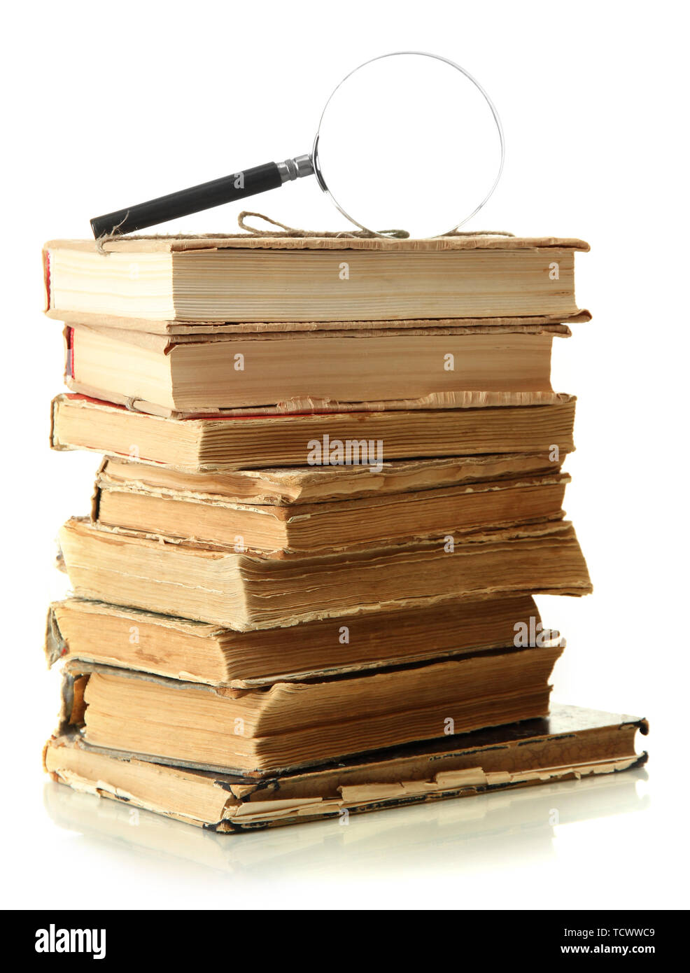 Magnifying glass and books isolated on white Stock Photo - Alamy