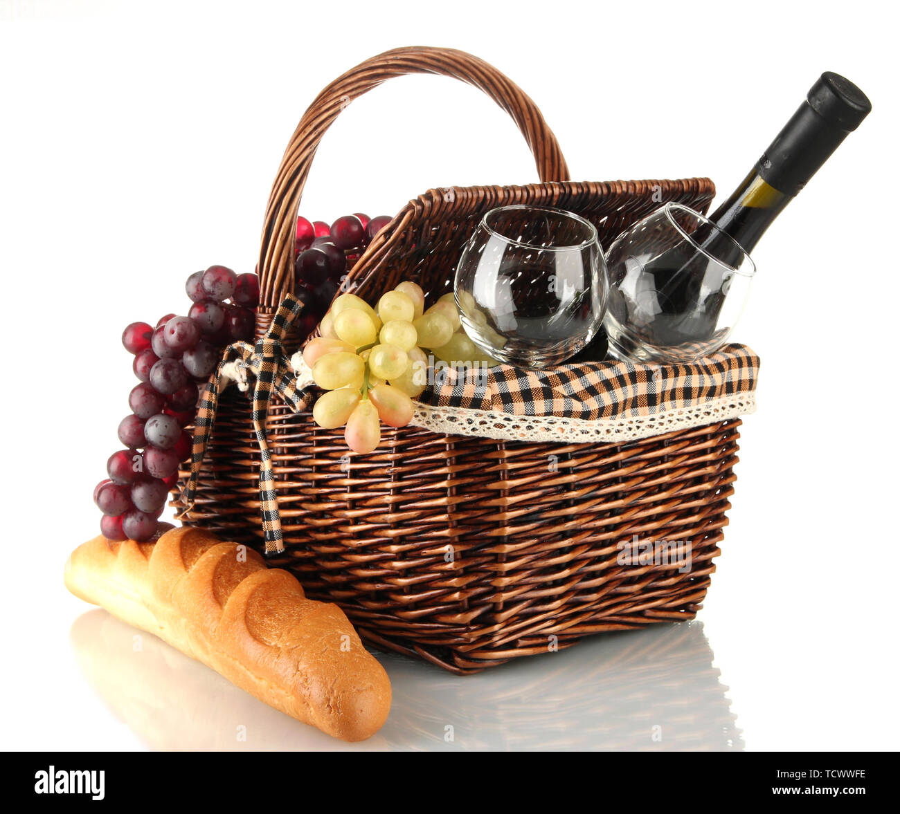 Picnic basket with fruits and bottle of wine isolated on white Stock ...