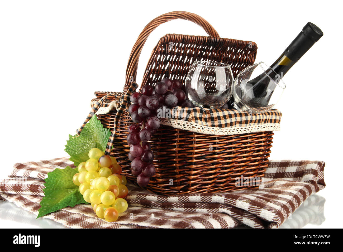 Picnic basket with fruits and bottle of wine isolated on white Stock ...