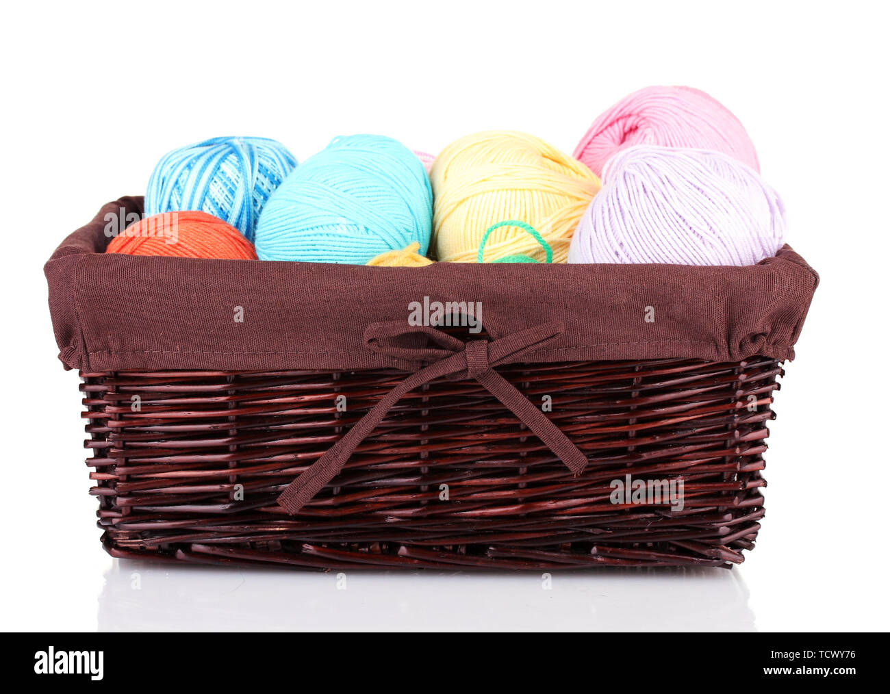 Colorful yarn balls in wicker basket isolated on white Stock Photo - Alamy