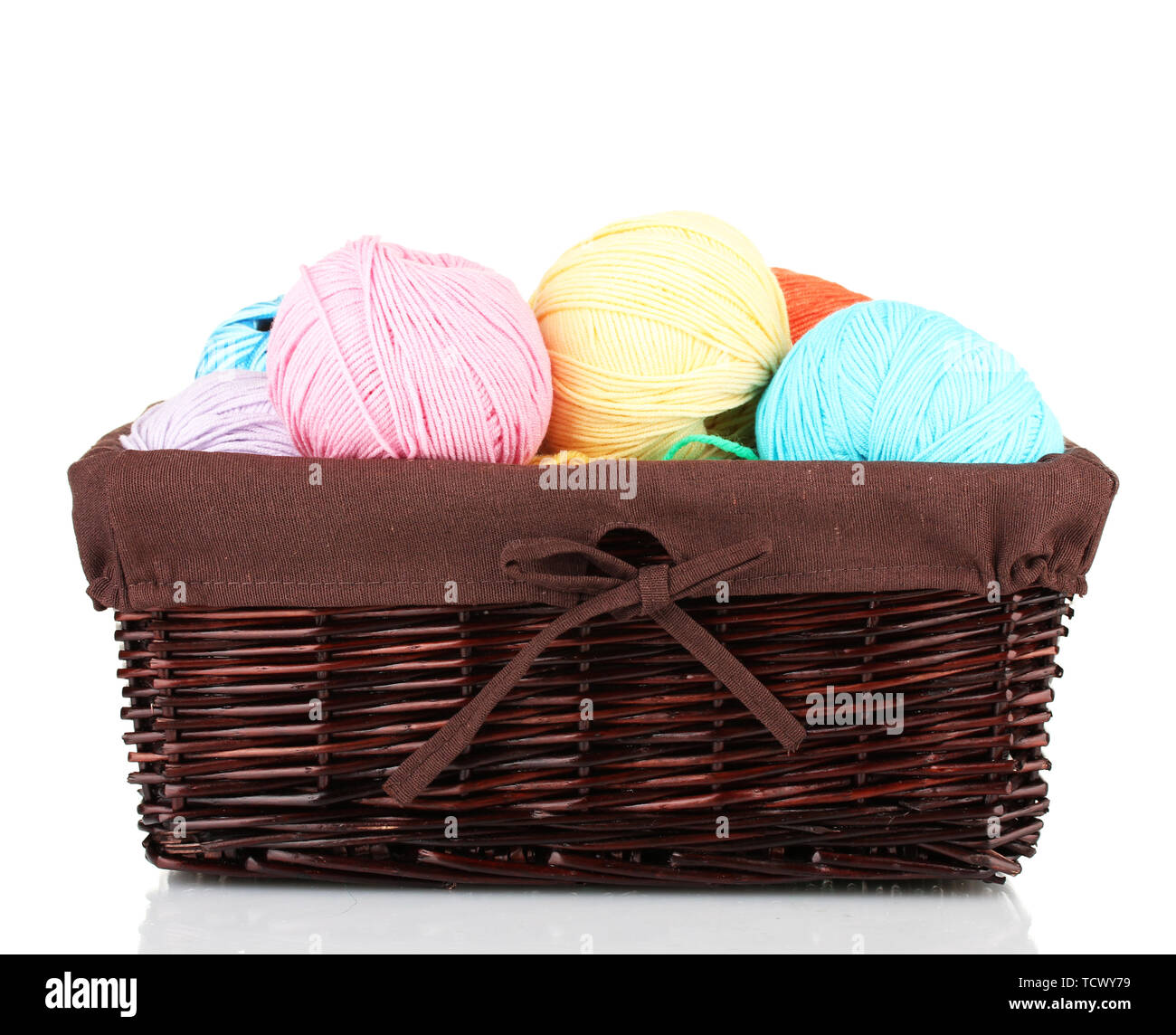 Colorful yarn balls in wicker basket isolated on white Stock Photo - Alamy