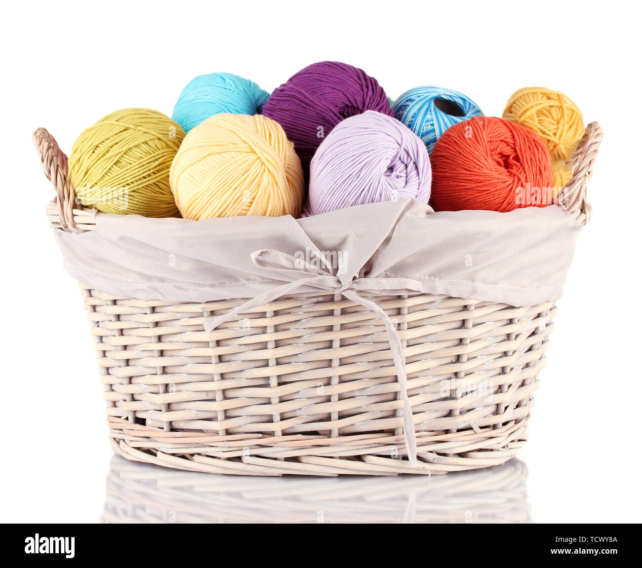 Colorful yarn balls in wicker basket isolated on white Stock Photo - Alamy
