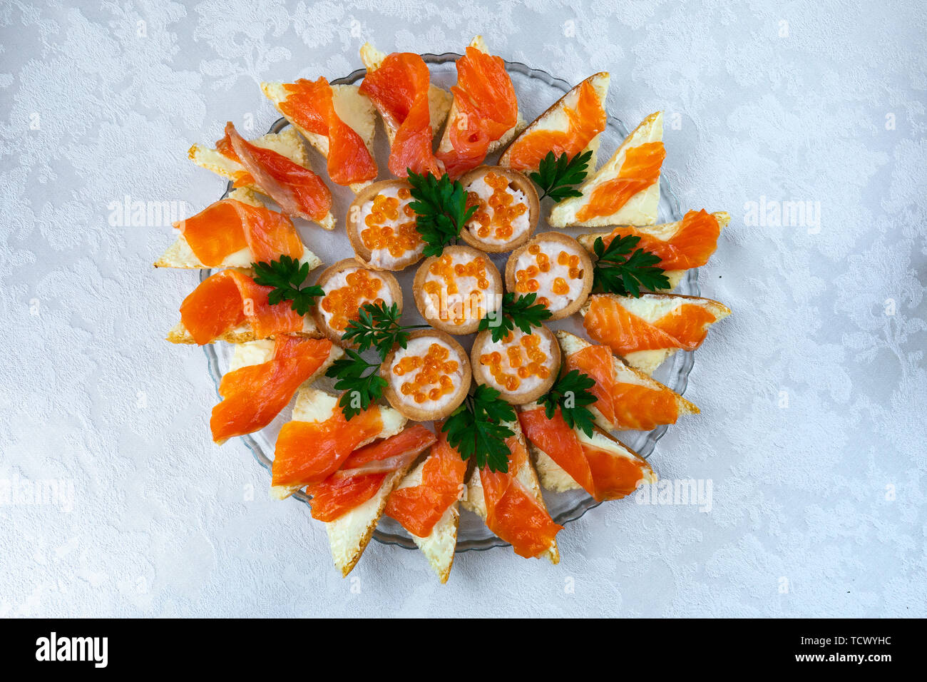 sandwiches with red fish and caviar on a plate close-up Stock Photo
