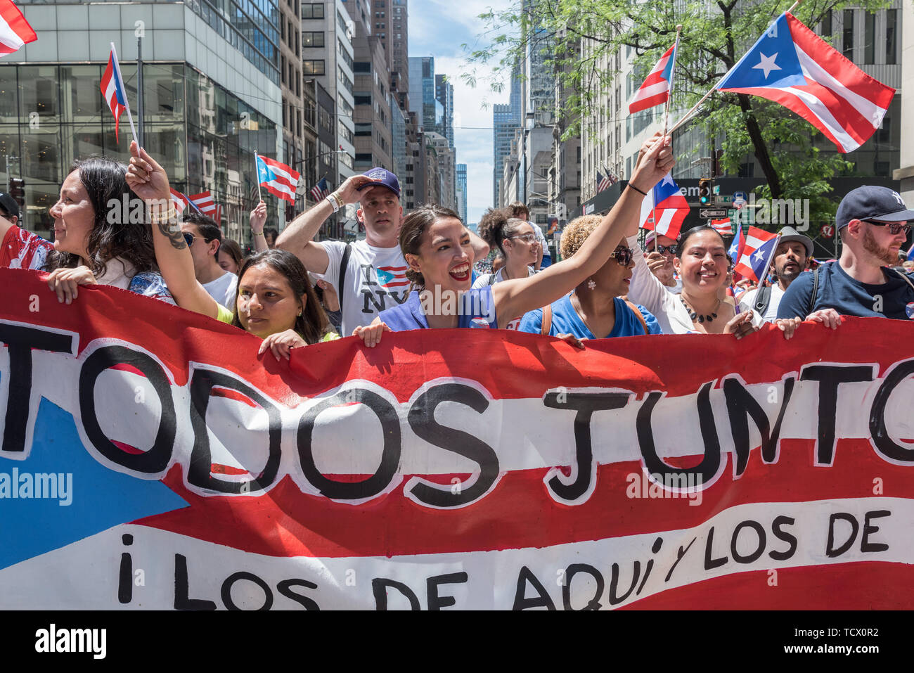 New York, USA. 09th June, 2019. Congresswoman Alexandria Ocasio-Cortez - On June 9, 2019, millions of people lined the streets along 5th Avenue in Midtown Manhattan celebrating their Puerto Rican heritage. In its 62nd year, the National Puerto Rican Day Parade is the largest parade of Puerto Rican culture. This year's theme was 'Un Pueblo, Muchas Voces' (One Nation, Many Voices) celebrating the diversity of Puerto Rico. Credit: Gabriele Holtermann-Gorden/Pacific Press/Alamy Live News Stock Photo