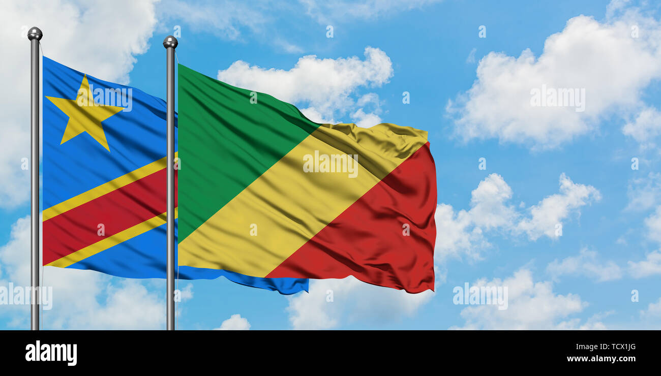 Congo and Republic Of The Congo flag waving in the wind against white cloudy blue sky together. Diplomacy concept, international relations. Stock Photo