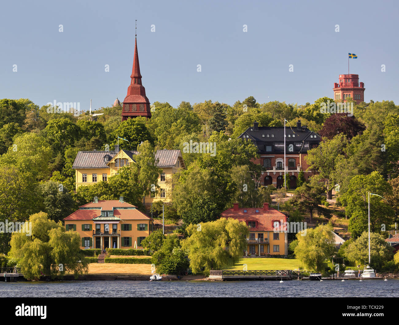Large Djurgården villas next to Waldemarsviken dring a sunny summer afternoon in Stockholm, Sweden Stock Photo
