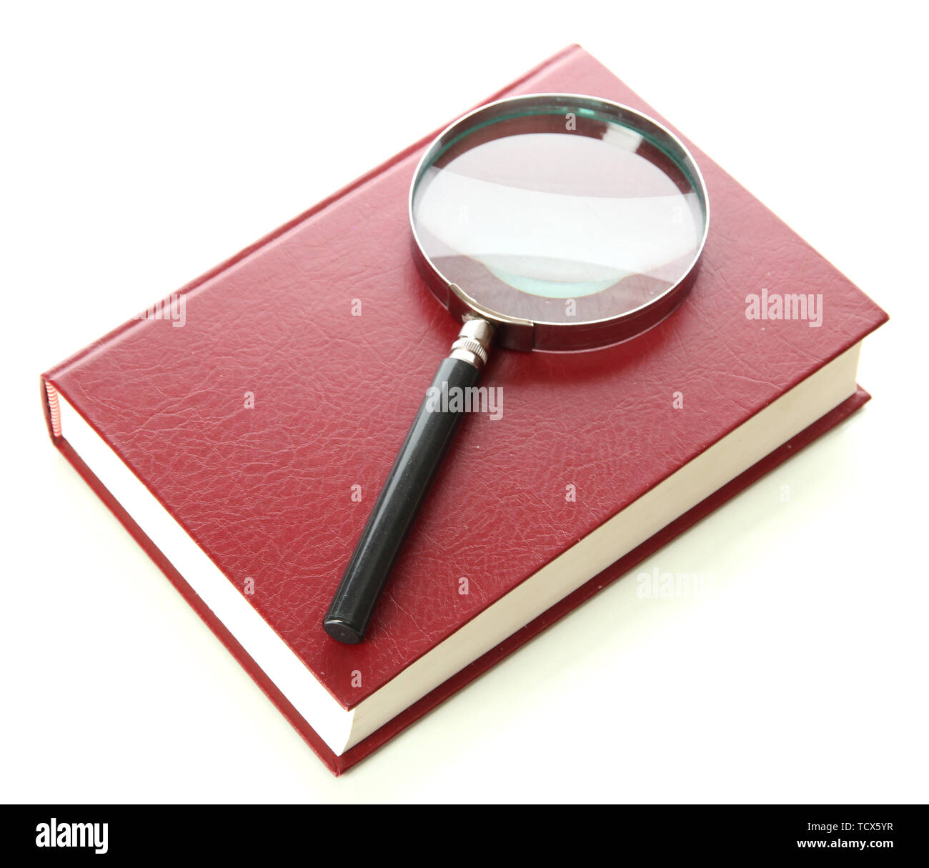 Magnifying glass and book isolated on white Stock Photo - Alamy