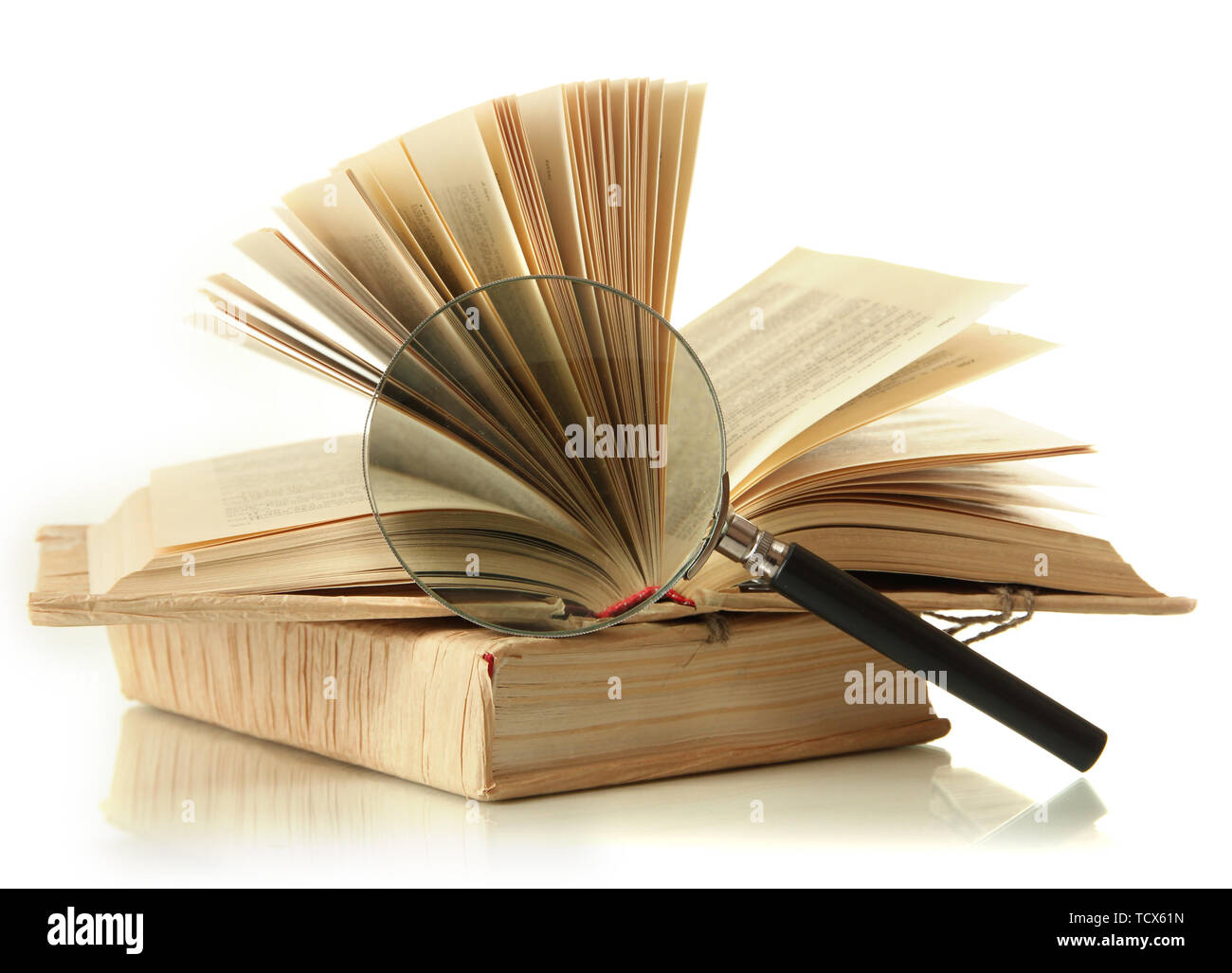 Magnifying glass and open book isolated on white Stock Photo - Alamy