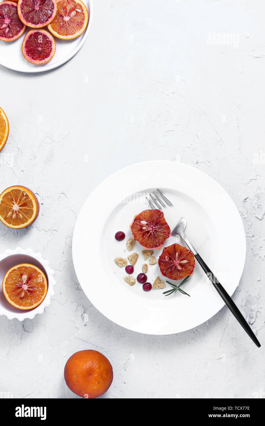 One person eating yogurt cereal fruit breakfast on white background Stock Photo