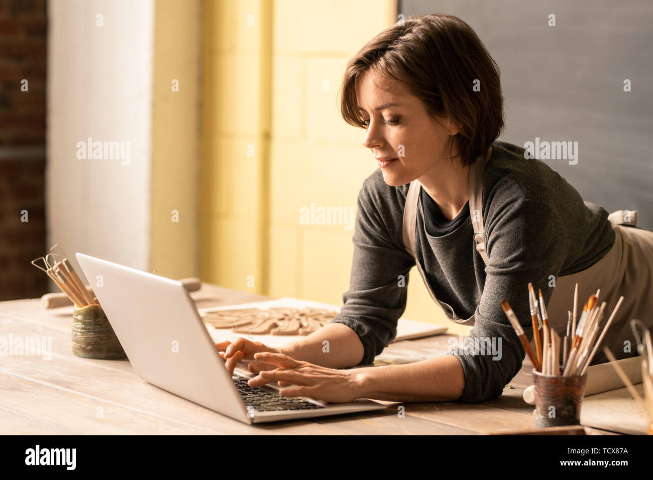 Designer browsing in the net Stock Photo