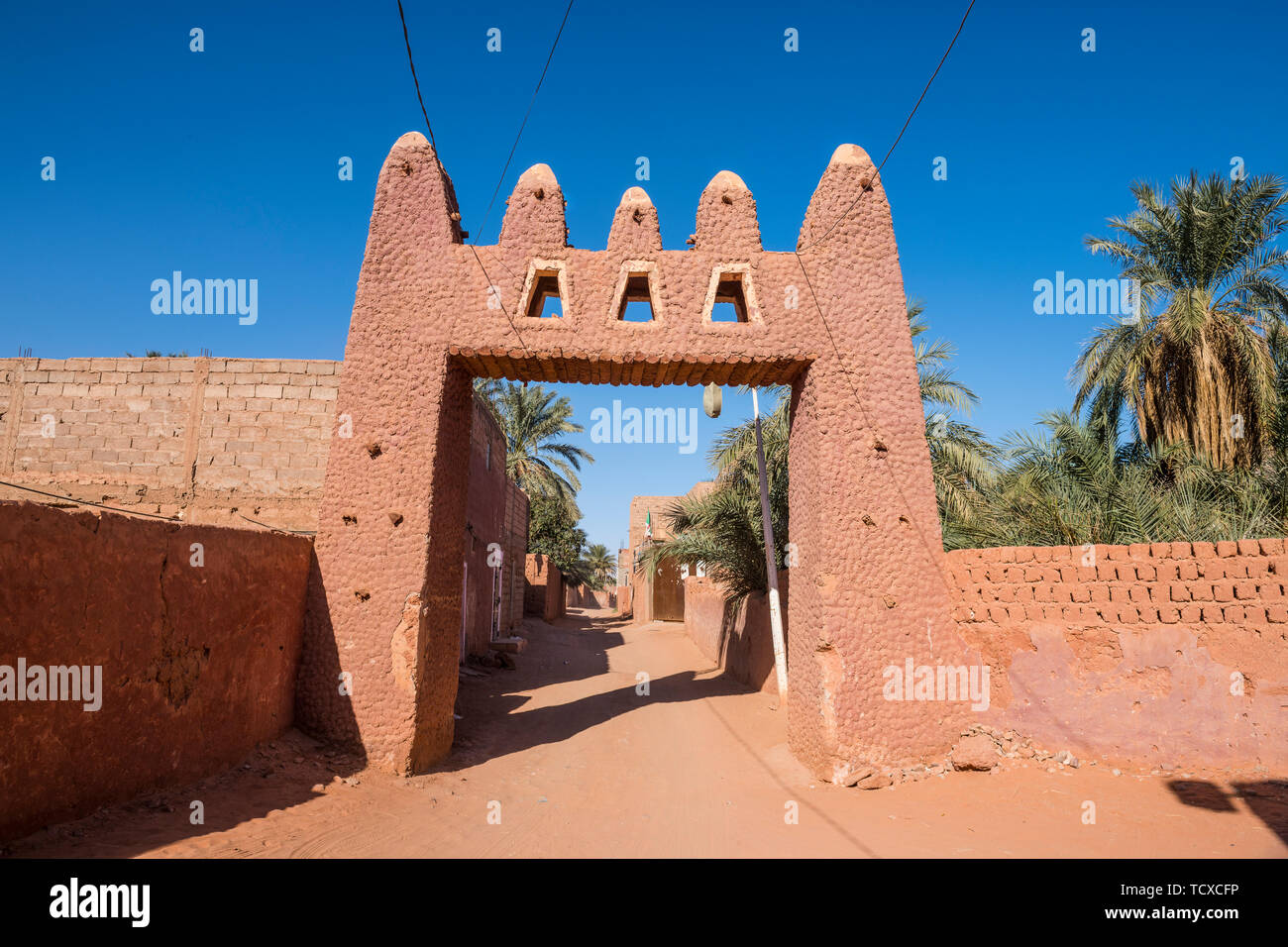 Red town gate in Timimoun, western Algeria, North Africa, Africa Stock Photo