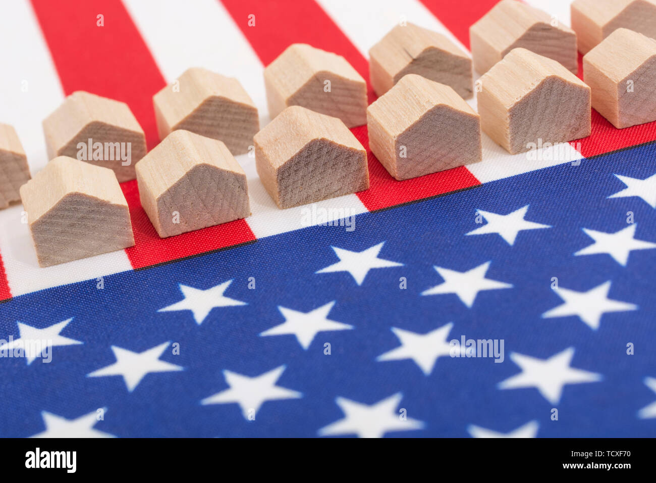 U.S. Stars & Stripes + toy houses. Metaphor US America real estate realty business, getting on property ladder, US construction industry, US subprimes Stock Photo