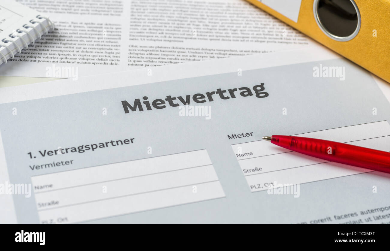 A Rental agreement with a pen on a desk - Mietvertrag (German) Stock Photo