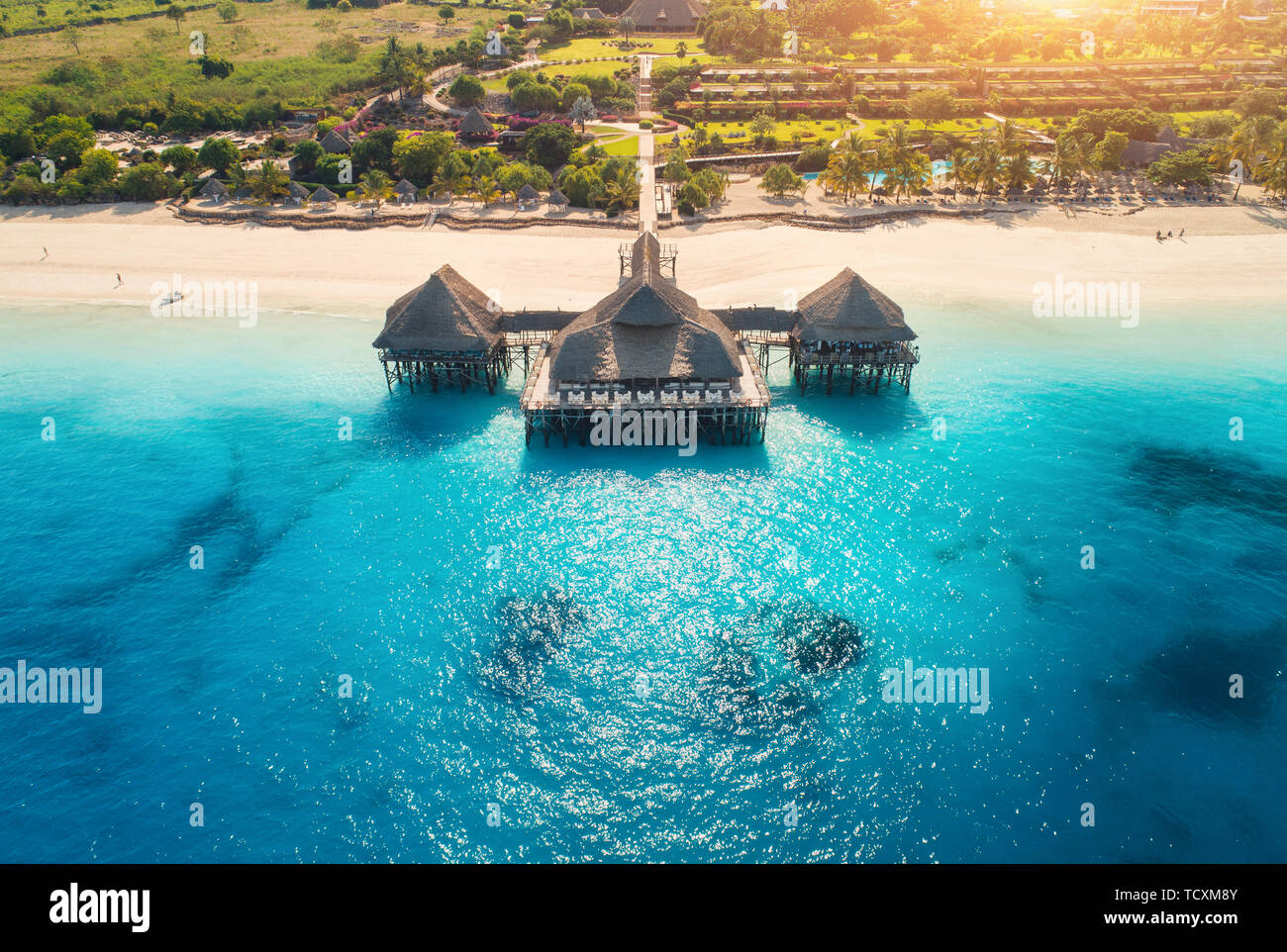 Aerial view of beautiful hotel in Indian ocean at sunset in summer Stock Photo