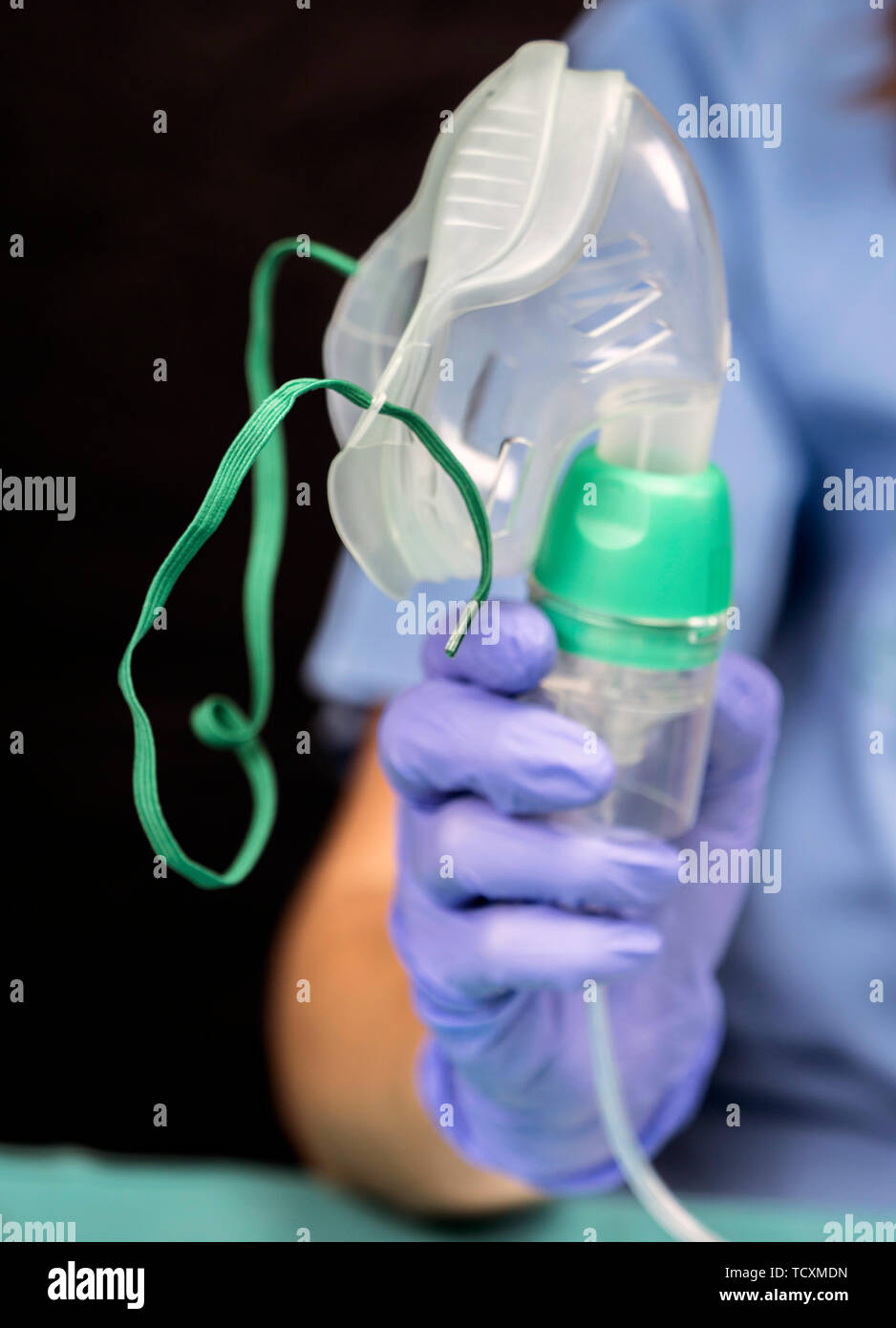 Nurse prepares oxygen mask in hospital, conceptual image Stock Photo