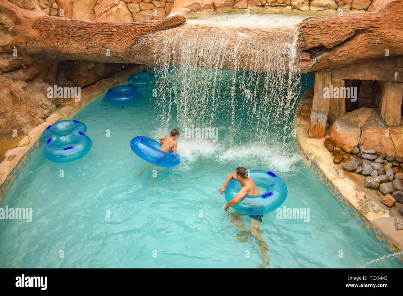 Orlando Florida April 07 19 Man And Boy Floating At Lazy River In Aquatica Water Park Stock Photo Alamy