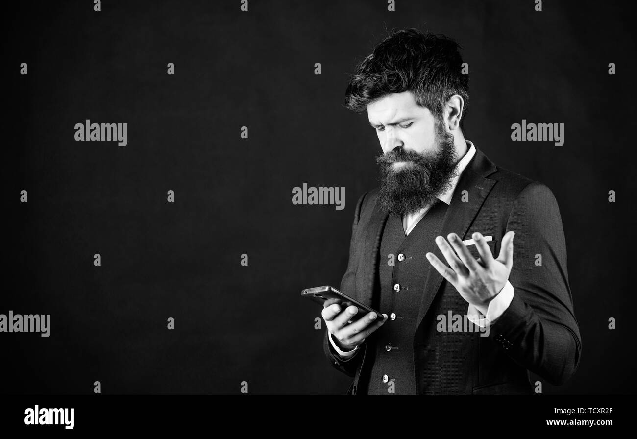 Honeguy Using Internet Guy surfing internet smartphone black background. Online service and ...