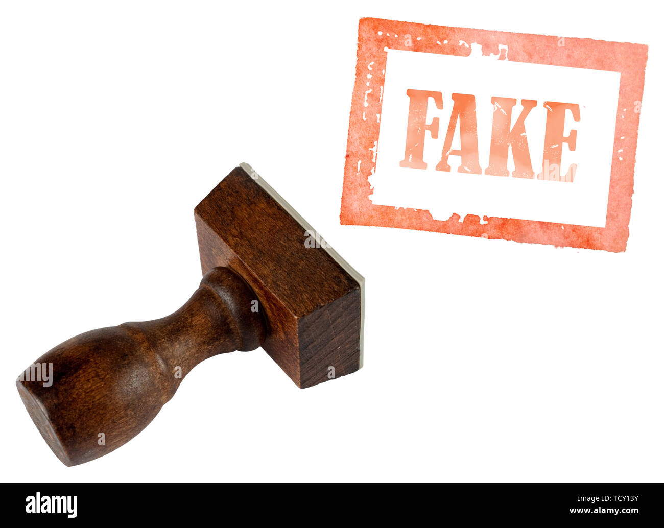Genuine fake, rubber stamp isolated on white. Business, politics or trade ethical concept. Stock Photo