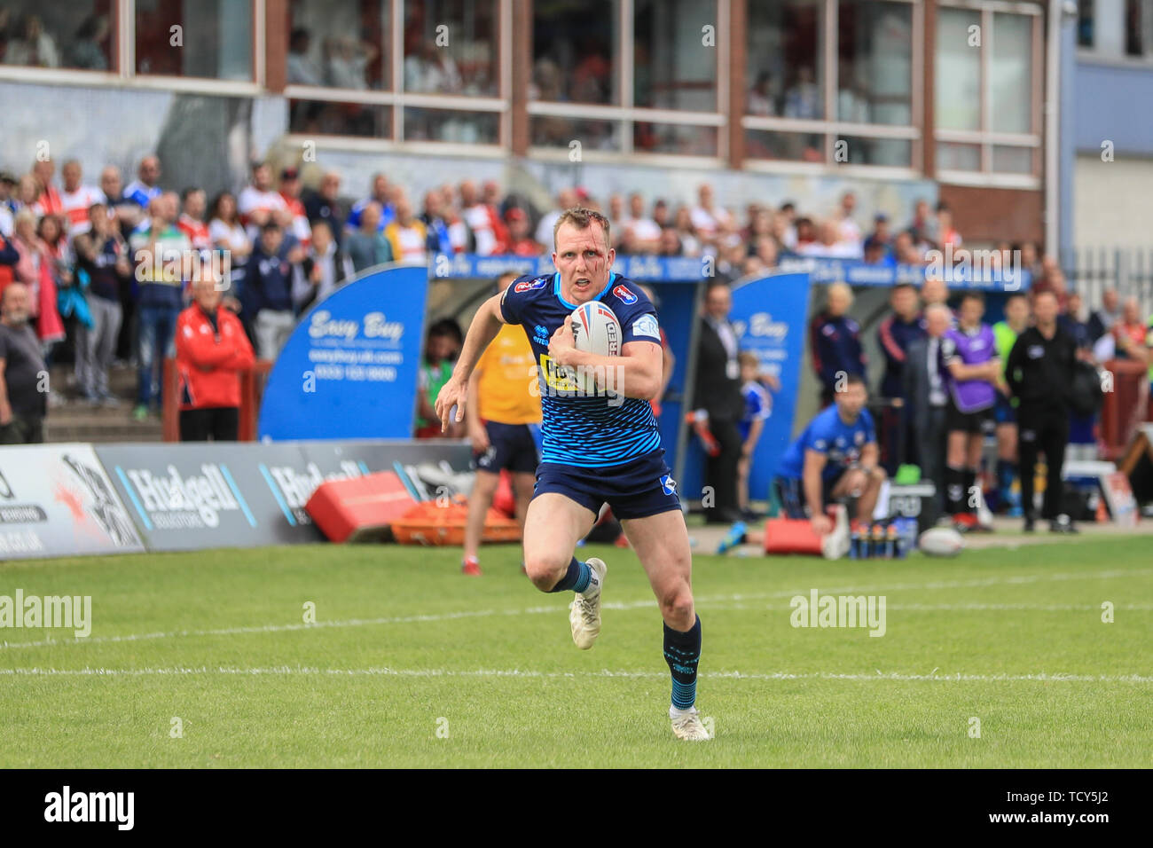 9th June 2019 , KCOM Craven Park, Hull, England;  Betfred Super League, Round 17, Hull KR vs Wigan Warriors ; Dan Sarginson (3) of Wigan Warriors breaks through to score Wigans second try  Credit: Mark Cosgrove/News Images Stock Photo