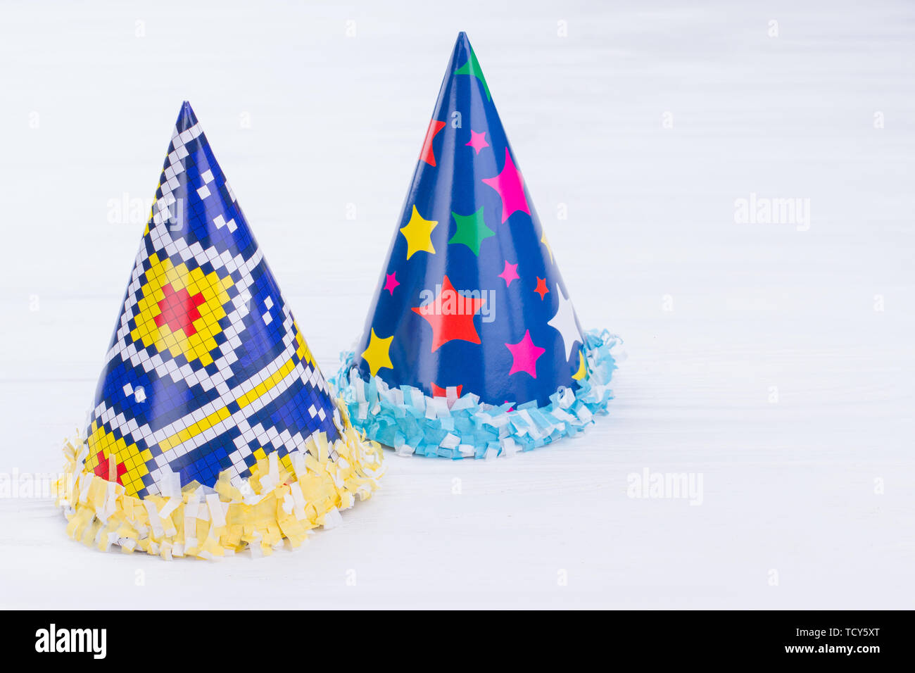Two blue party hats made from paper Stock Photo - Alamy