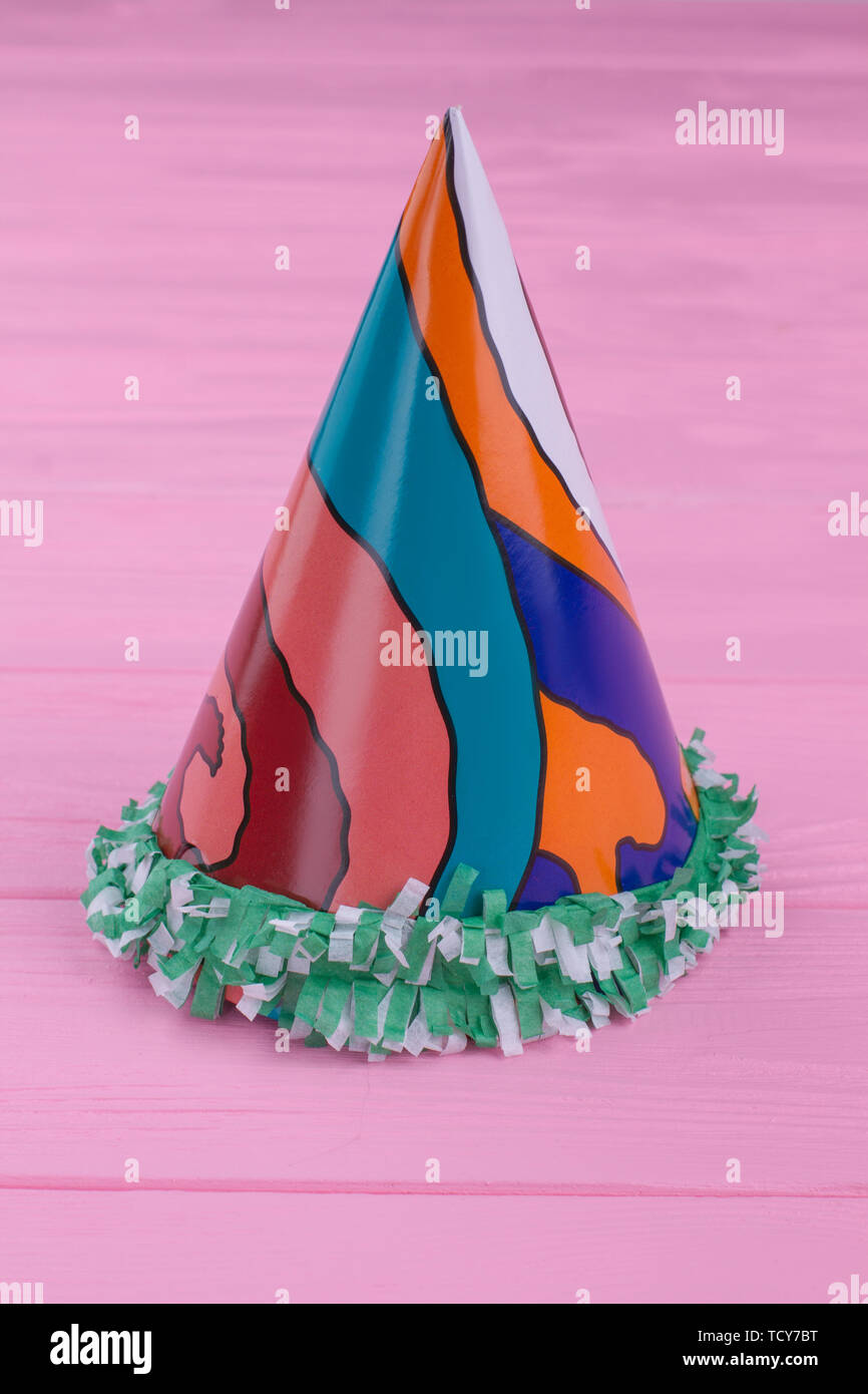 Colorful party hat on pink background Stock Photo - Alamy