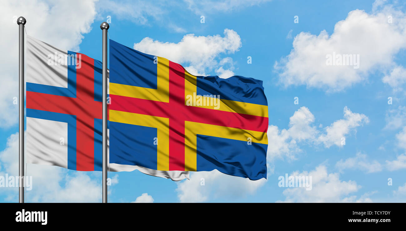 Faroe Islands And Aland Islands Flag Waving In The Wind Against White Cloudy Blue Sky Together Diplomacy Concept International Relations Stock Photo Alamy