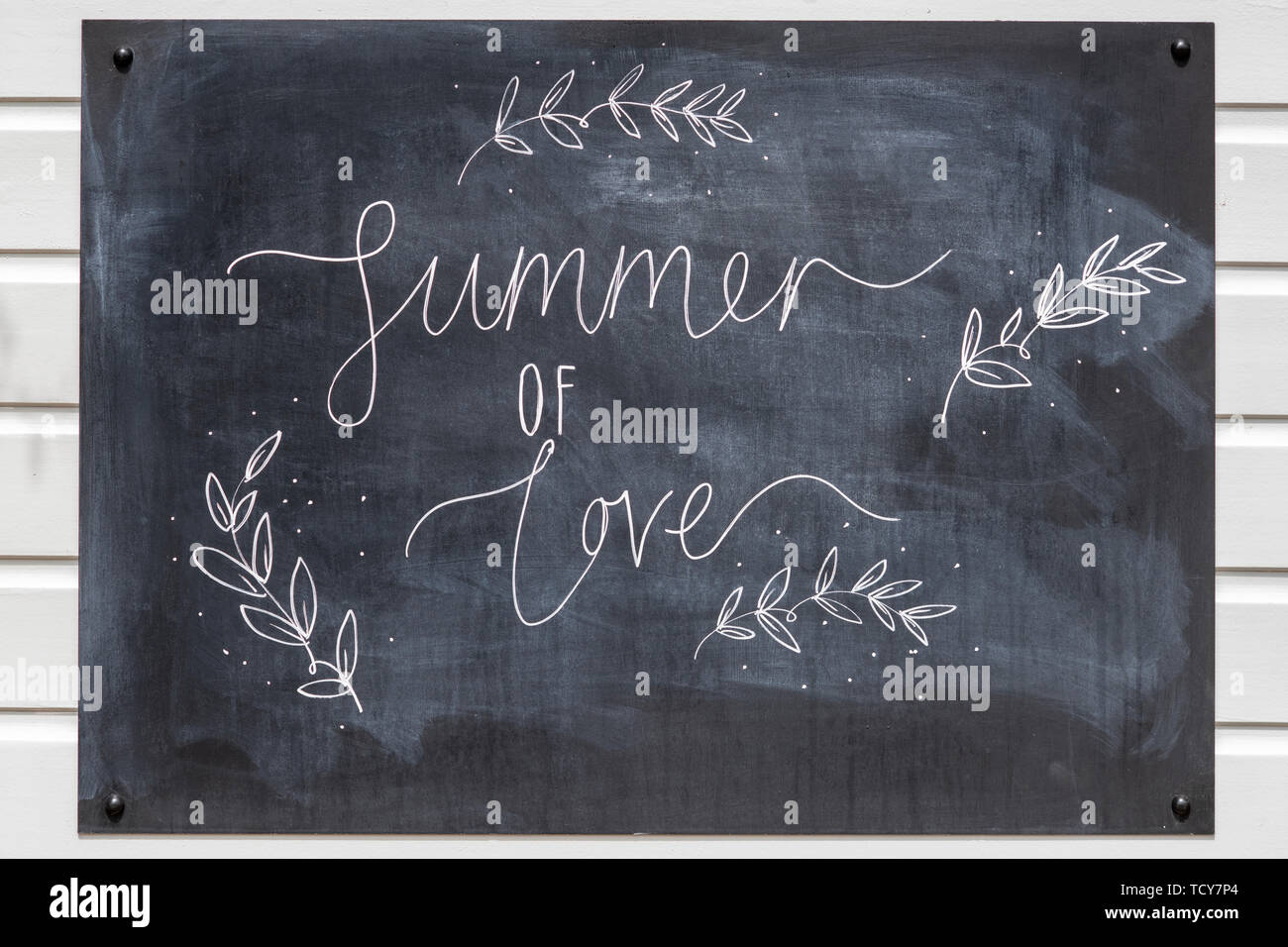 Summer of love chalkboard at Daylesford Organic farm summer festival. Daylesford, Cotswolds, Gloucestershire, England Stock Photo