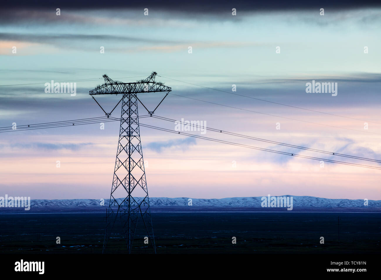 power pylon in wild field with white snow Stock Photo - Alamy