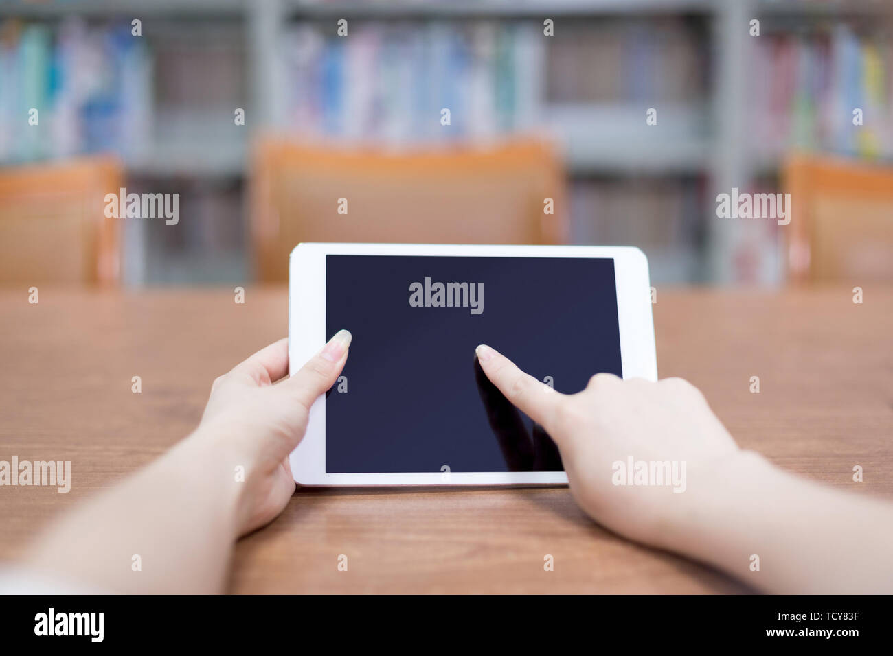Hand Tablet In Library Stock Photo Alamy Hand Tablet In Library Stock Photo Alamy