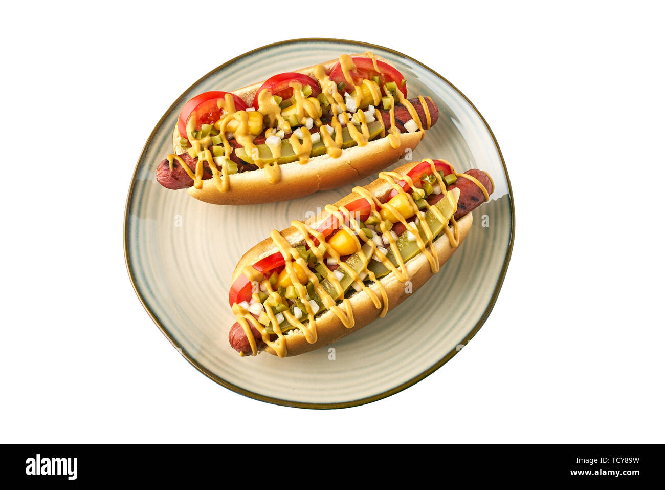 Two hot dogs on dish over white background Stock Photo