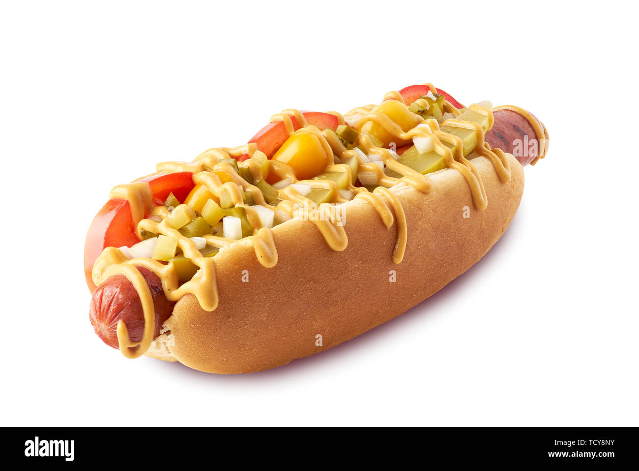 Hot dog with pickles and tomatoes on white Stock Photo