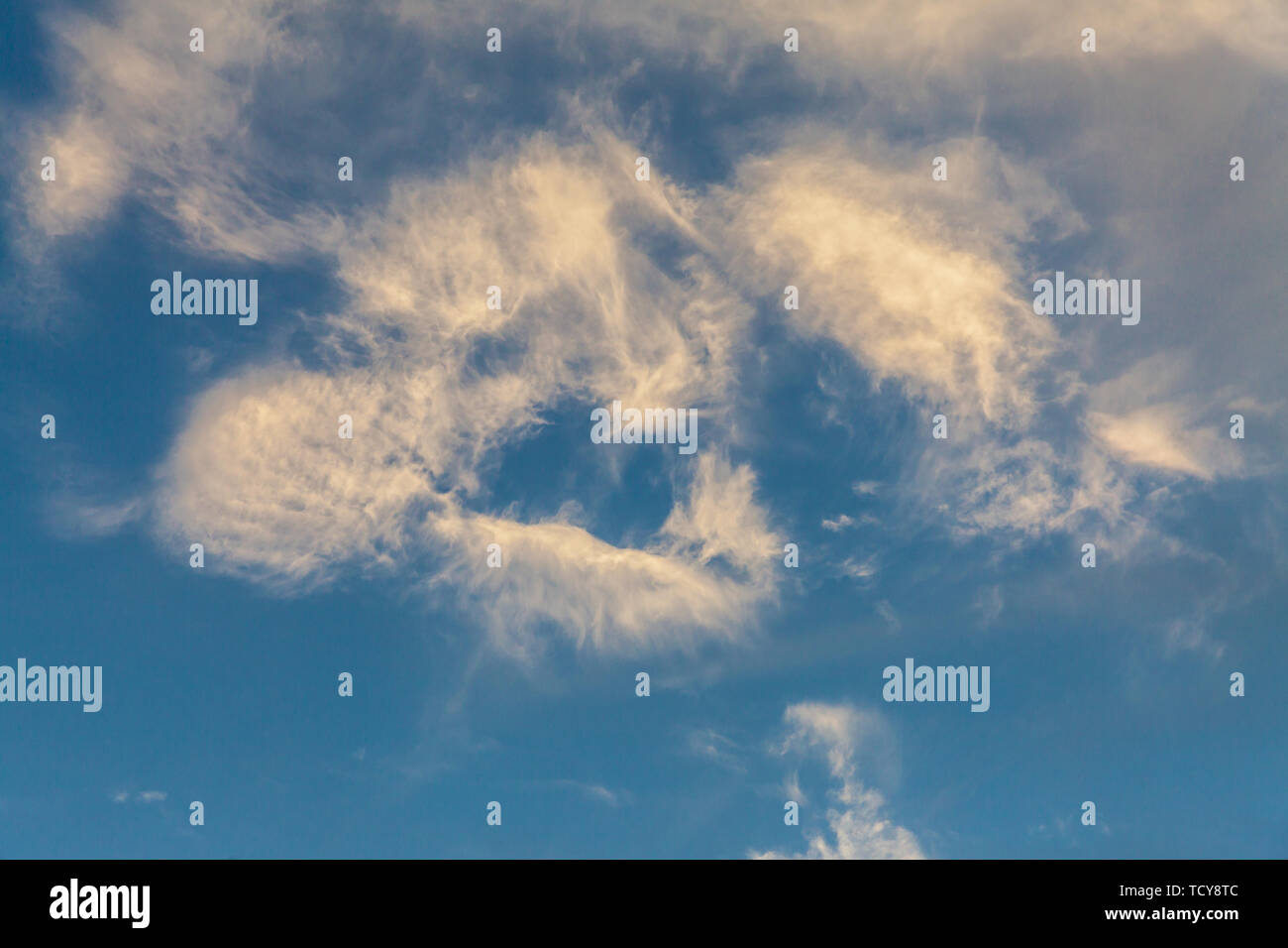 Blue sky, white clouds, tree background Stock Photo - Alamy