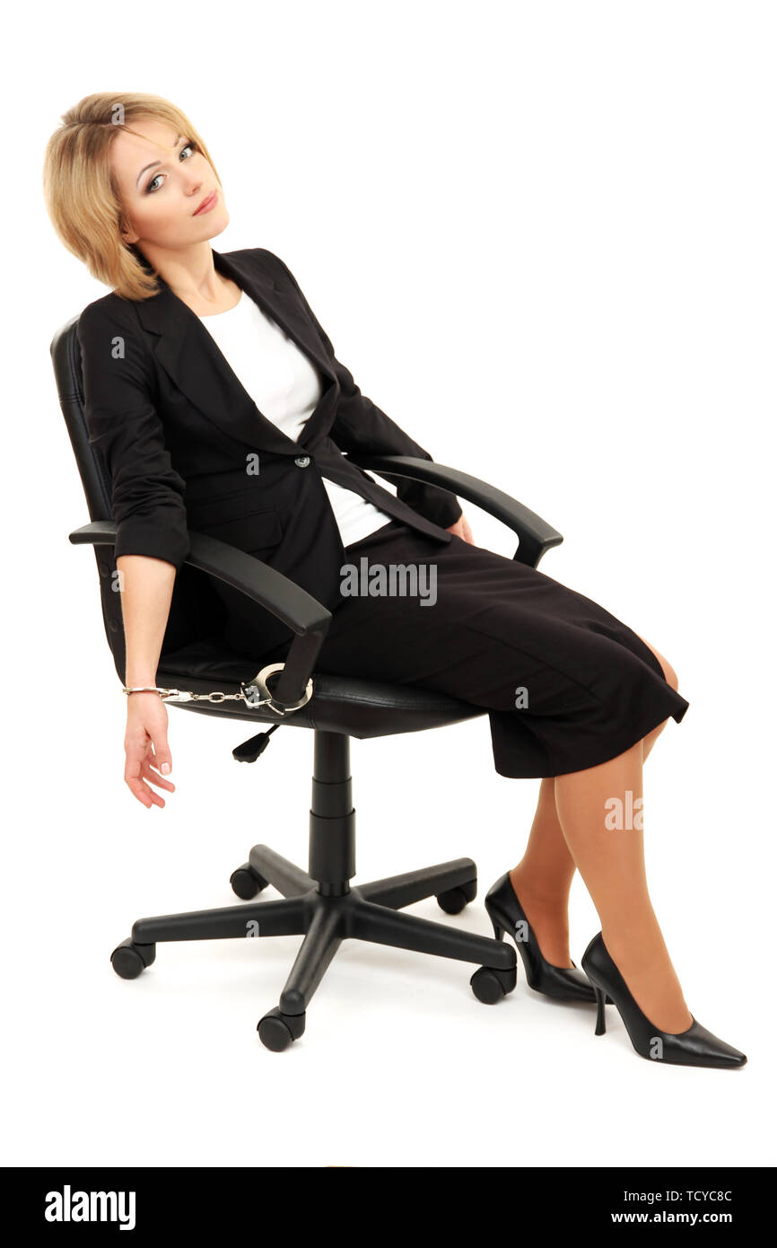 Young Beautiful Business Woman Strapped To Chair With Handcuffs