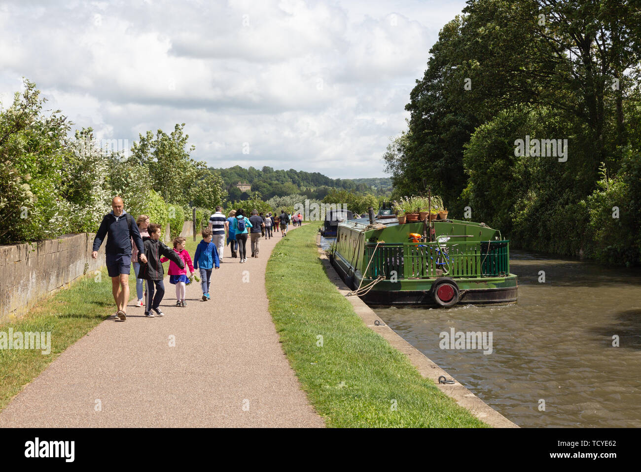 Somerset countryside, - a family walking along the Kennet and Avon canal from Bath to Bathampton on a sunny summer day in June, Somerset England UK Stock Photo