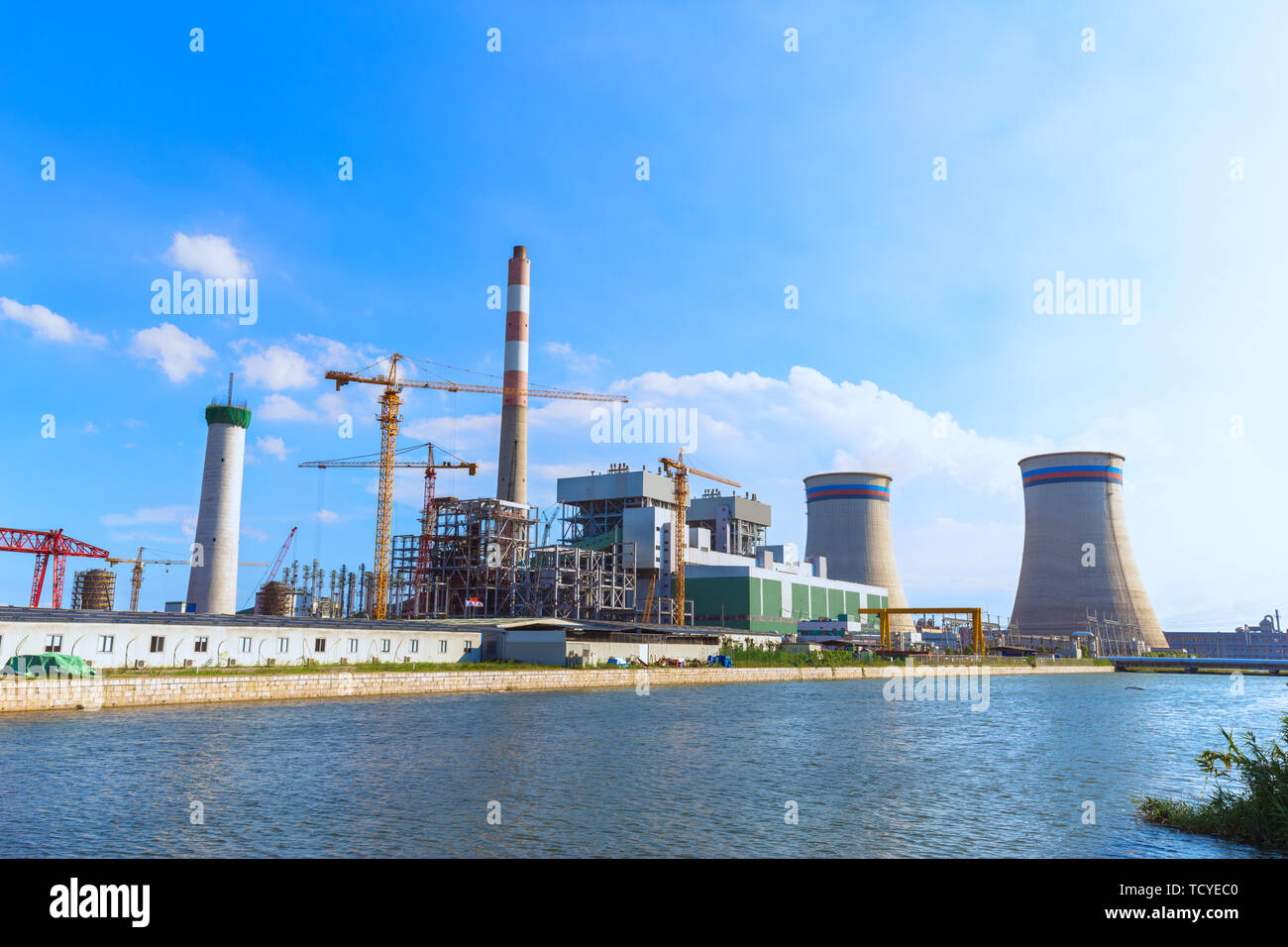 constructions inb modern power plant near river Stock Photo Alamy