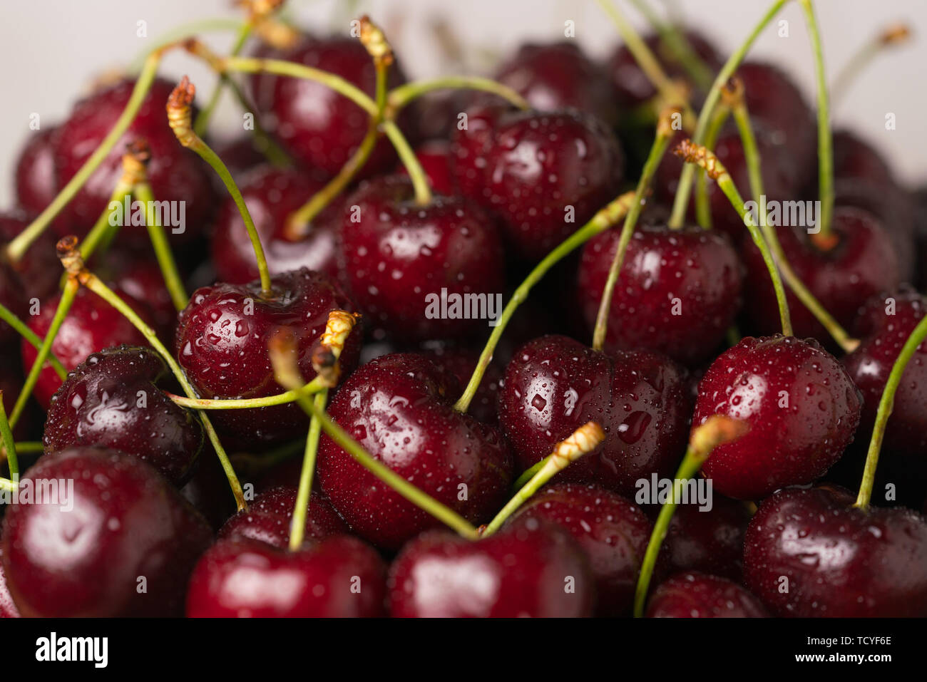 dark red ripe sweet cherry close up Stock Photo - Alamy