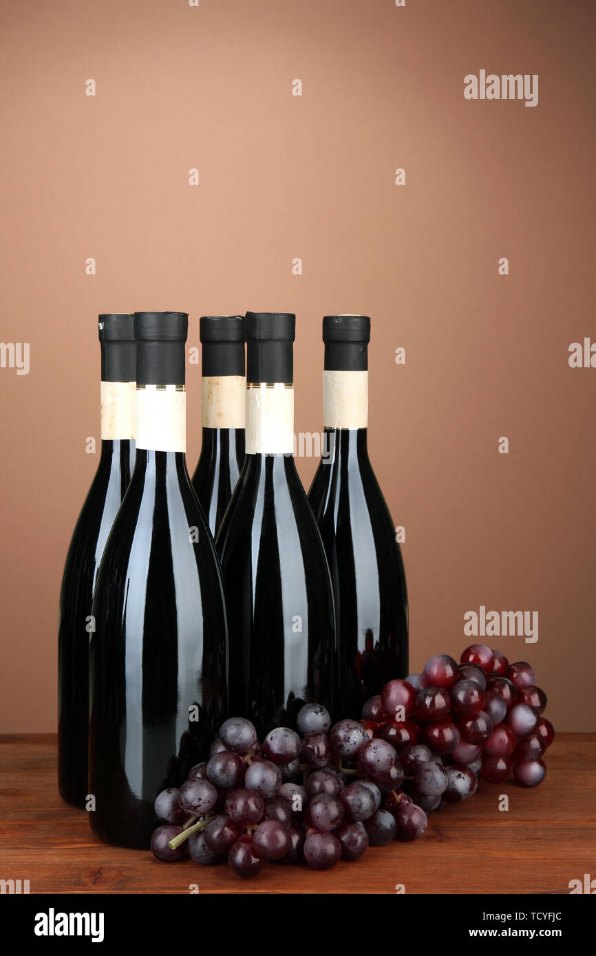 Wine bottles on brown background Stock Photo