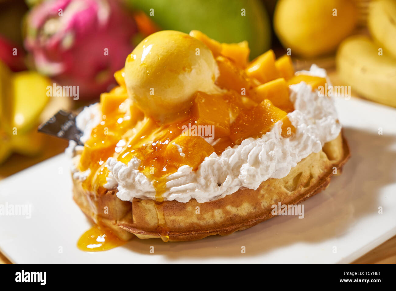 Mango ice cream stacked on muffins Stock Photo
