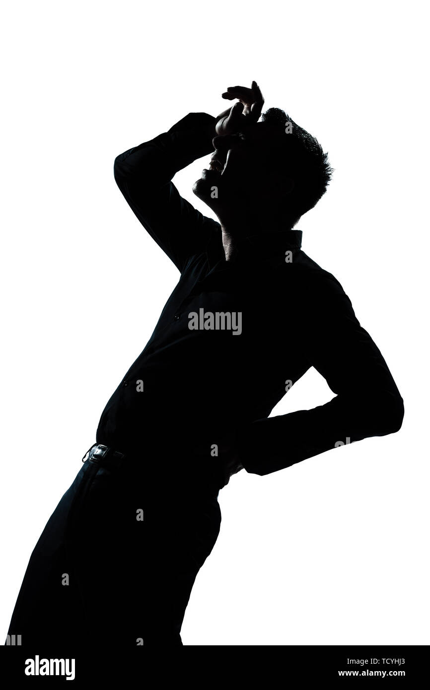 one caucasian man portrait silhouette pain backache in studio isolated white background Stock Photo