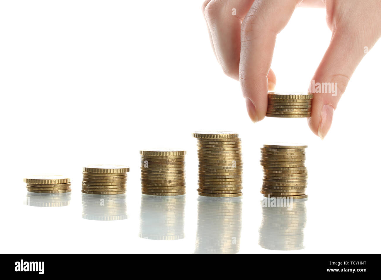 Hand holding coins isolated on white Stock Photo - Alamy