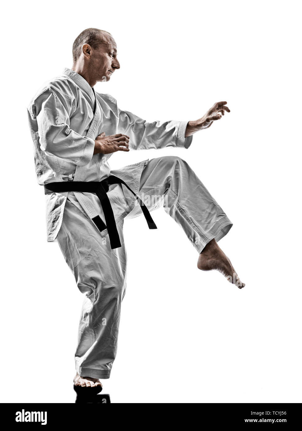one karate kata training man isolated on white background Stock Photo