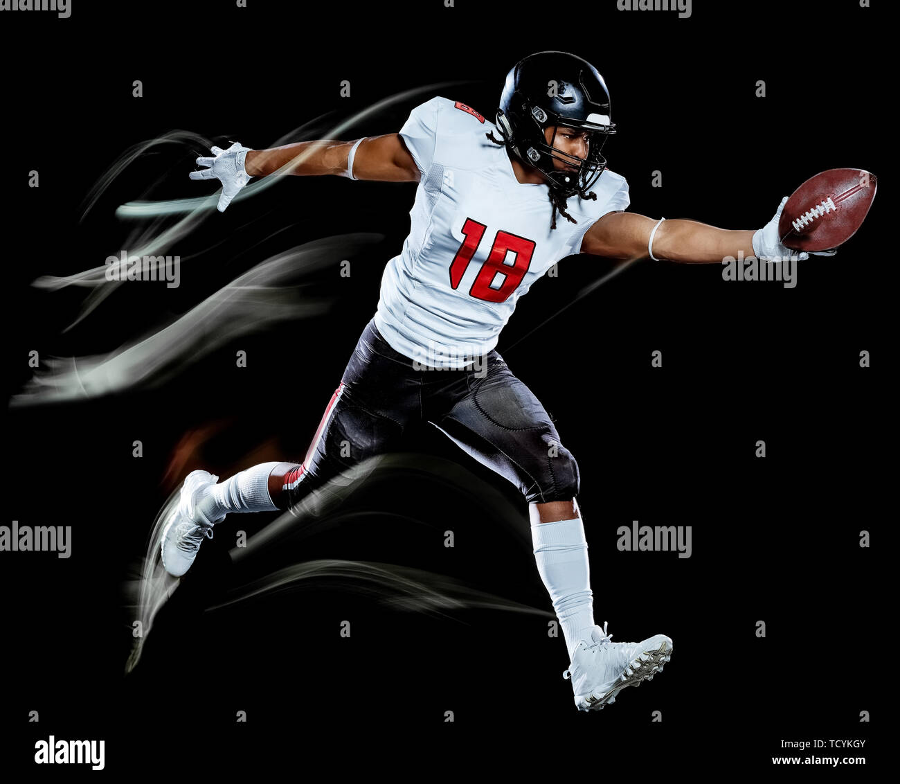 one african american football player man studio shot isolated on black background with light painting with blurred motion speed effect Stock Photo