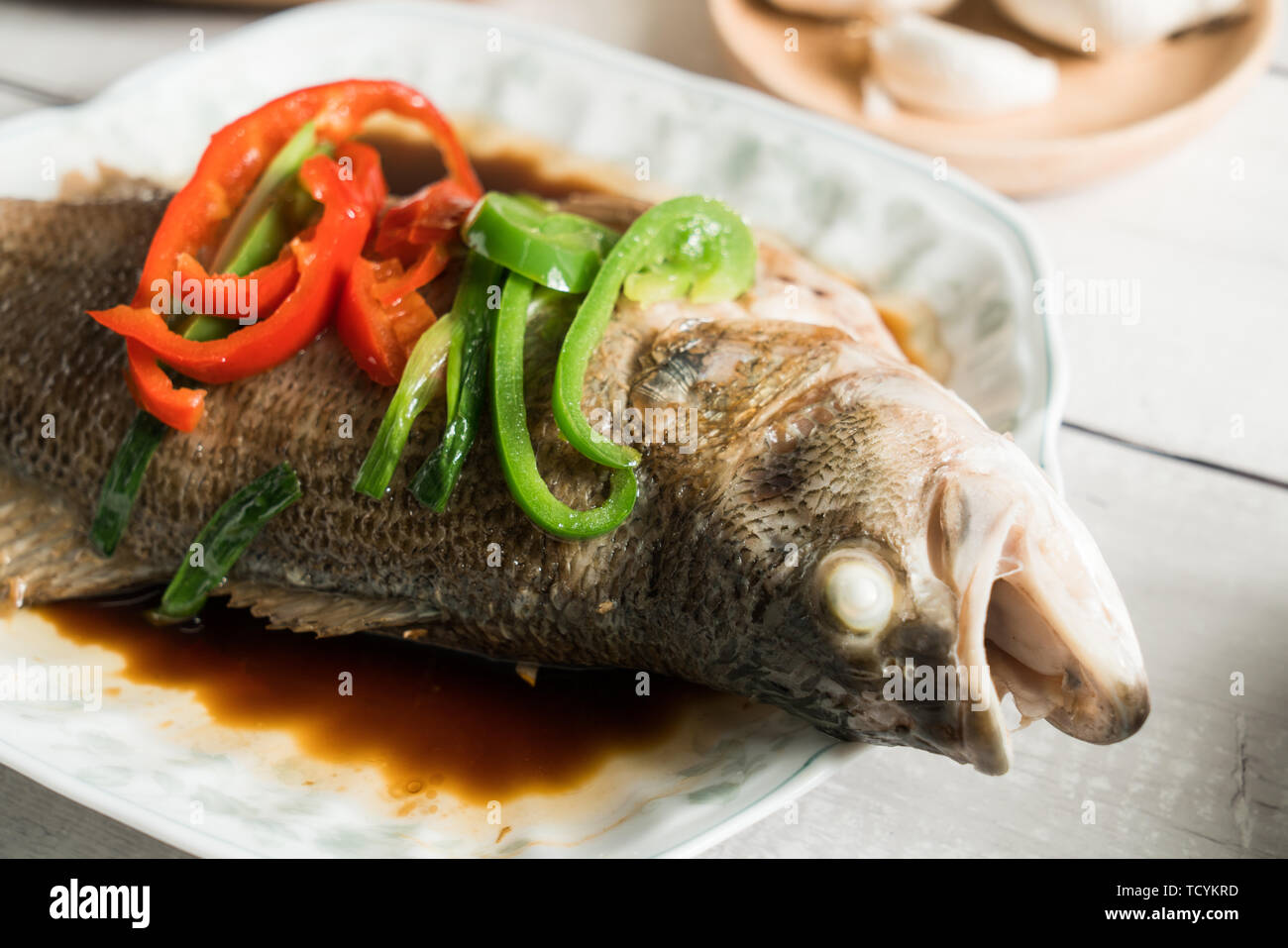 Steamed sea bass, traditional Cantonese cuisine Stock Photo Alamy