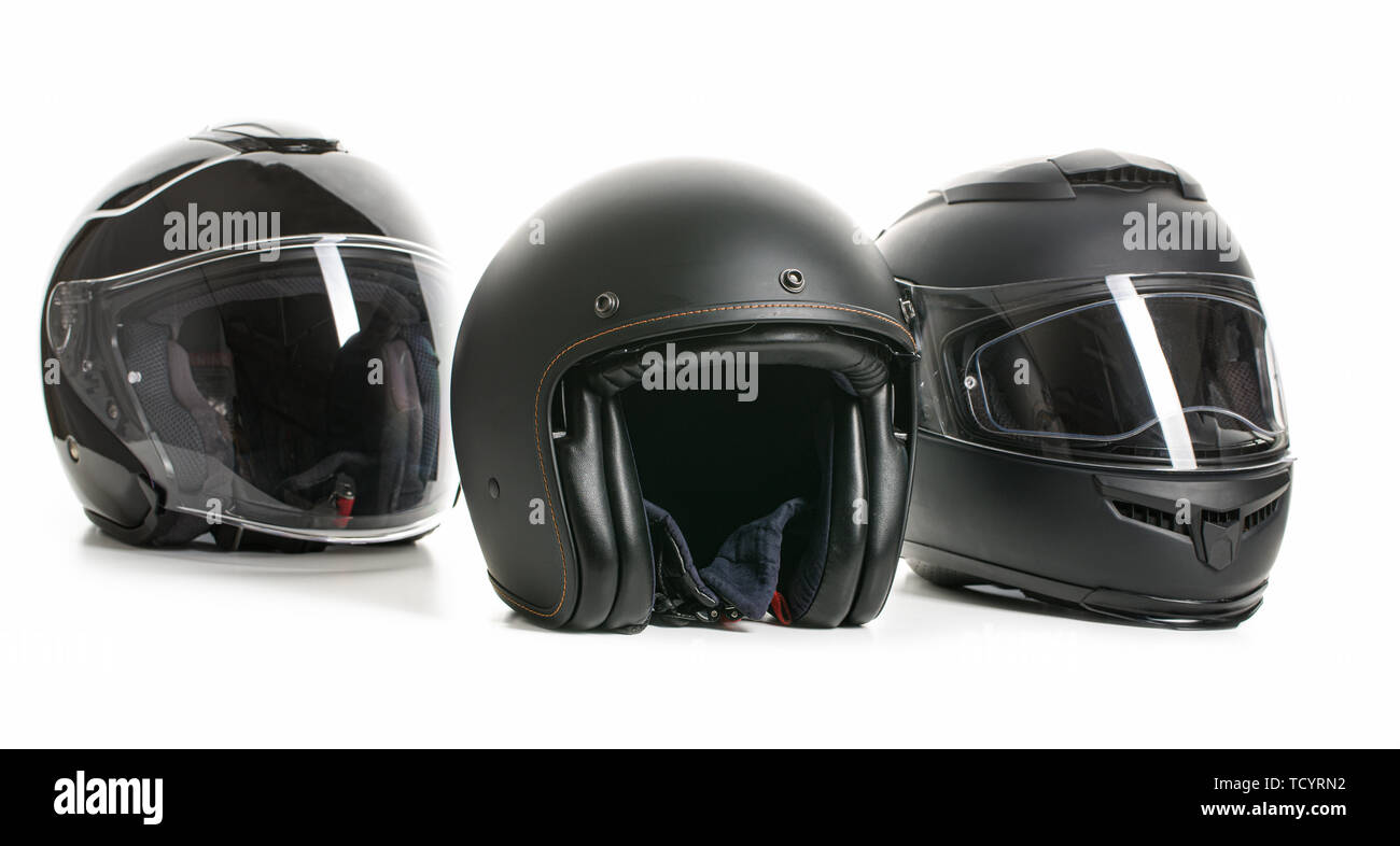 Three black motorcyle helmets isolated on white backgorund. Stock Photo