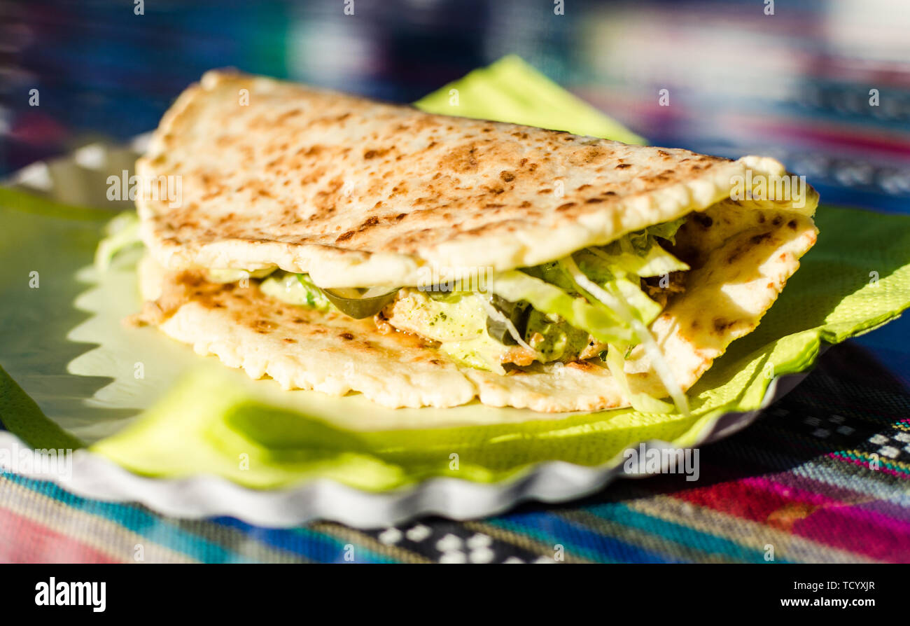 BBQ chicken sandwich made with cheese bread tortilla at a street food