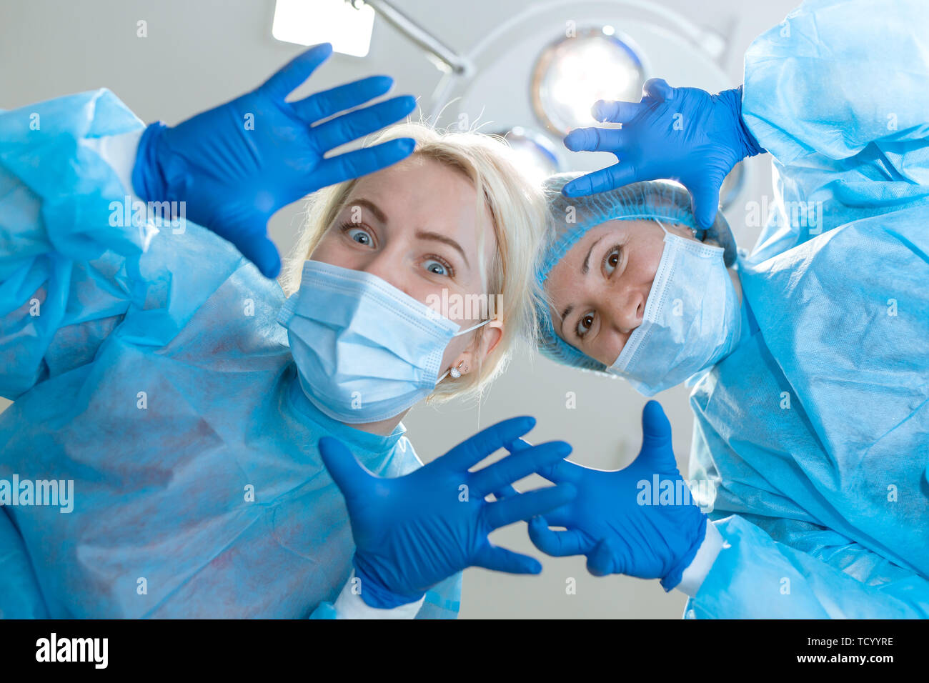 young women surgeons funny kidding on camera at operation room background Stock Photo - Alamy young women surgeons funny kidding on camera at operation room background Stock Photo - Alamy